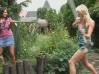 Two gorgeous girls play pink in the garden