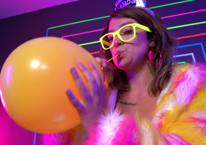 Glowing Birthday Girl Blows Balloons