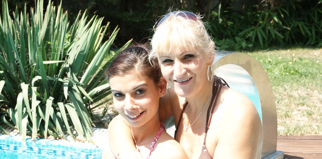 Mature lesbians playing in the pool