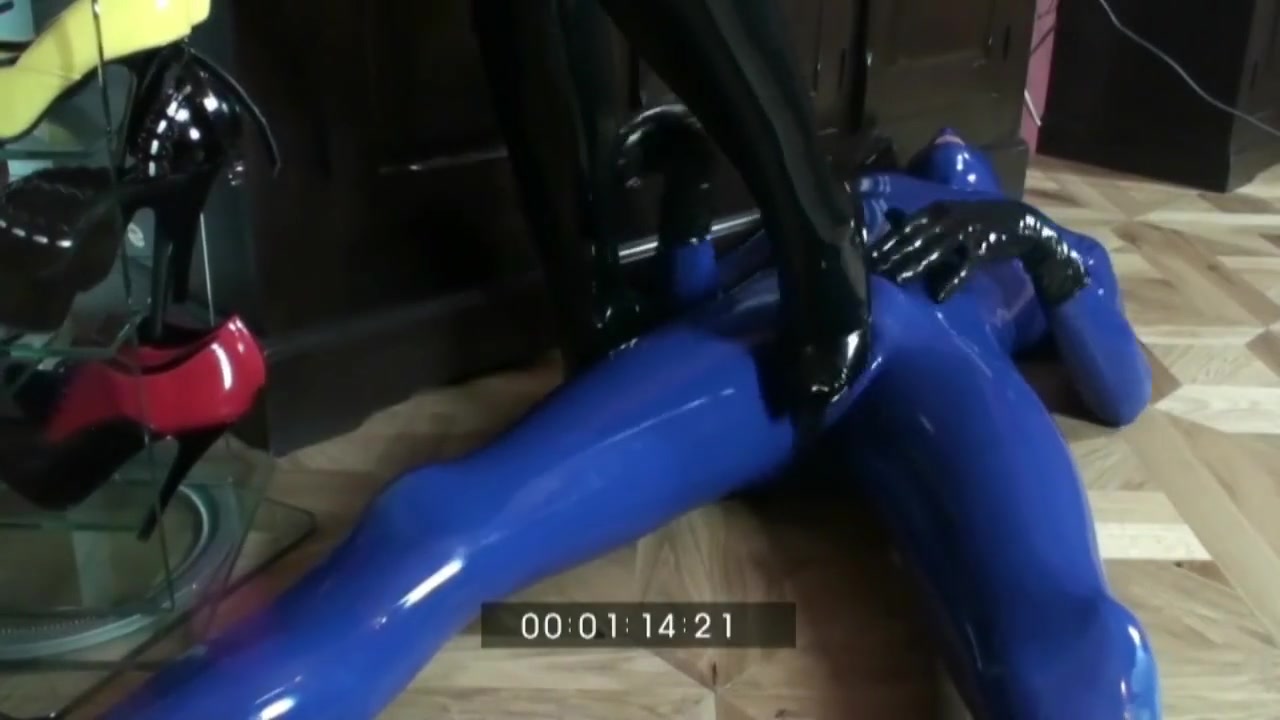 Femdom Girl In Black Latex Makes Heeljob And Piss An Her Rubber Male Sub