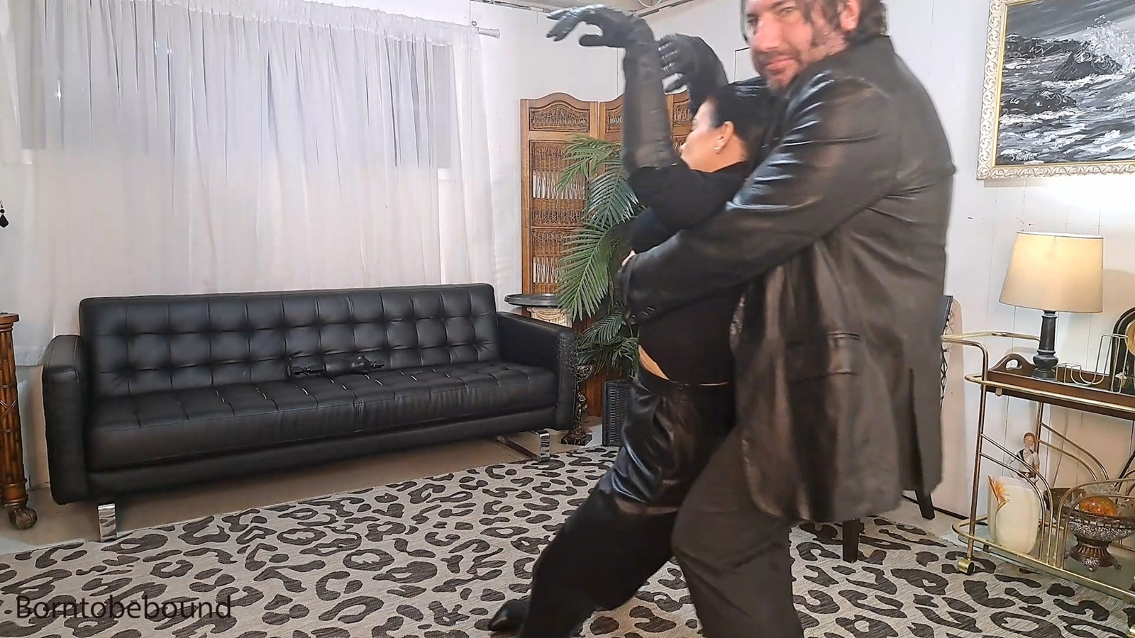 Lady in black taken away and tied up