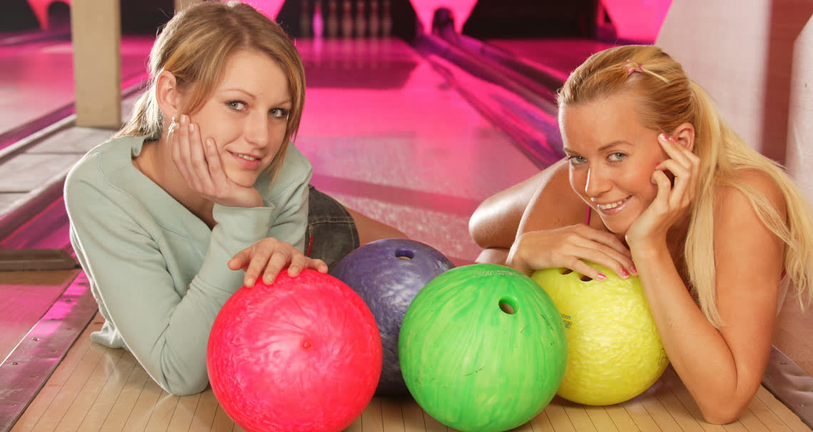 Young lesbians fuck each other in the bowling alley