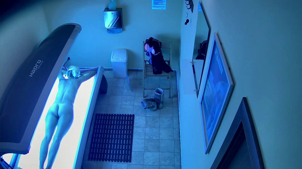 Blonde model enjoys the solarium