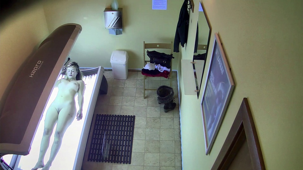 Blonde enjoys the solarium