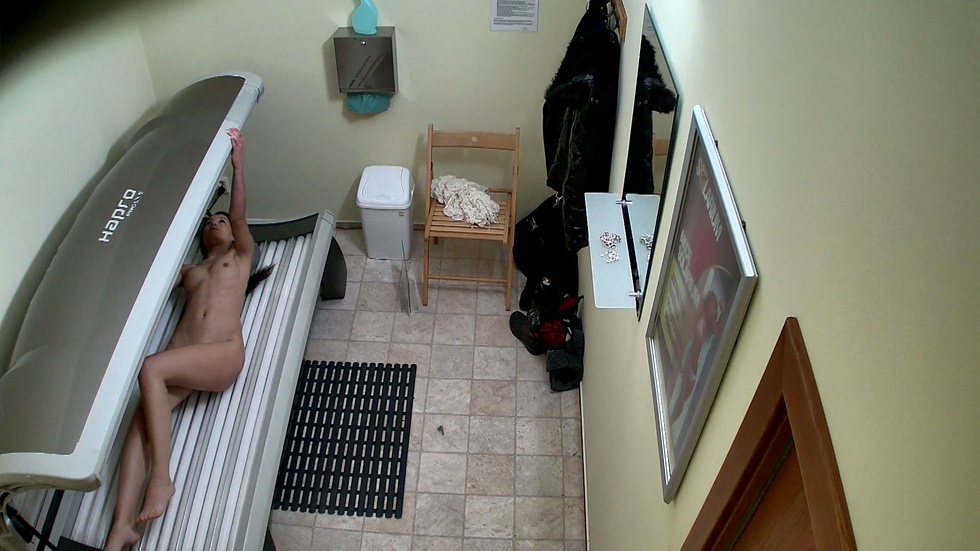 Young brunette came to solarium