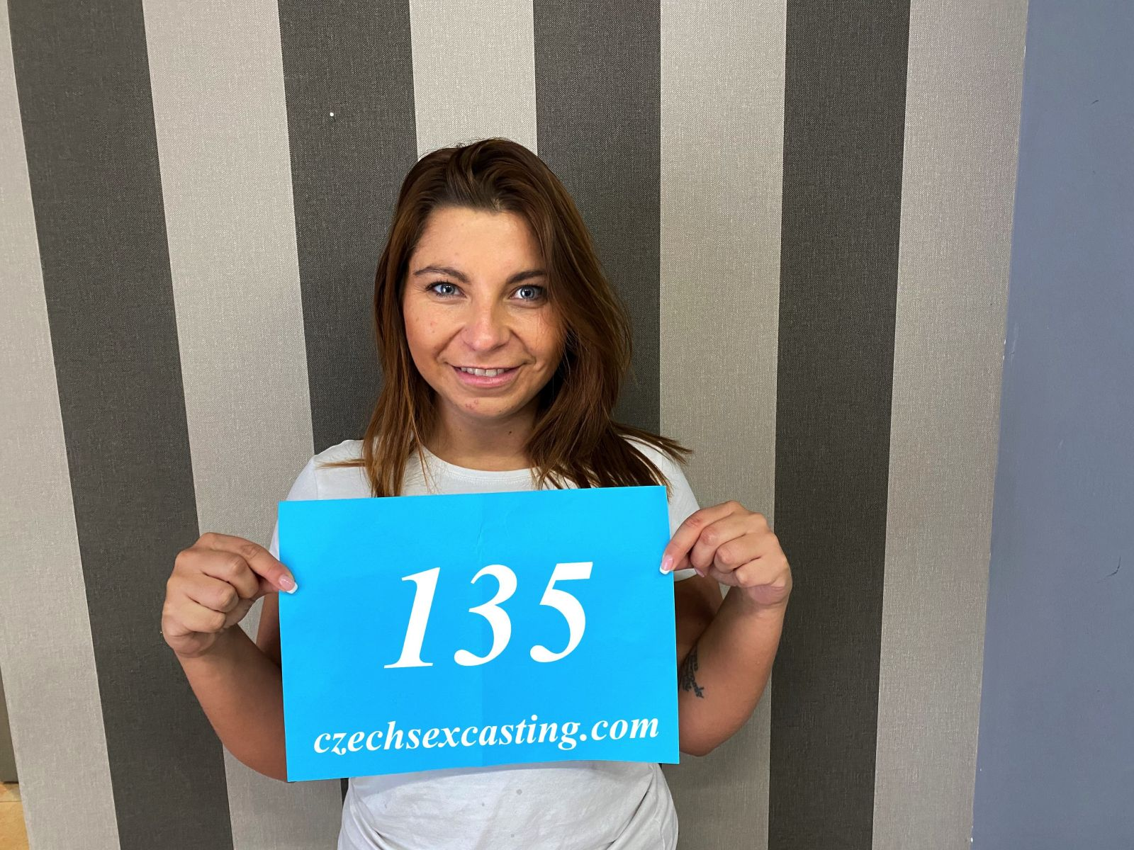 Busty Brunette Spreads for the Camera