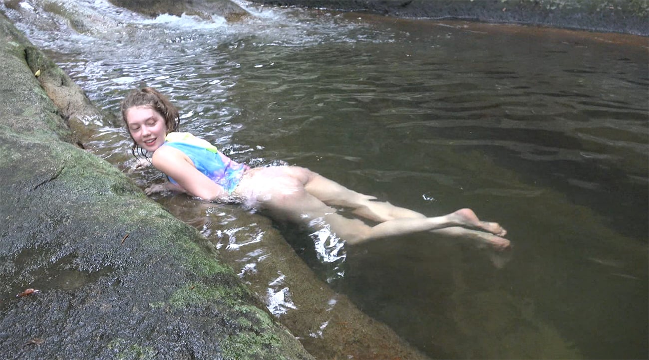 You Take Elena to Explore and You Find a Lovely Waterfall.