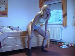Coed performs home striptease