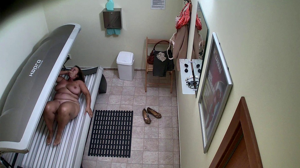 Busty and husky housewife in solarium