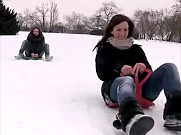 Two cute girls on a sled