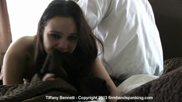 Topless Tiffany Bennett kicks and squirms her way through a bare spanking