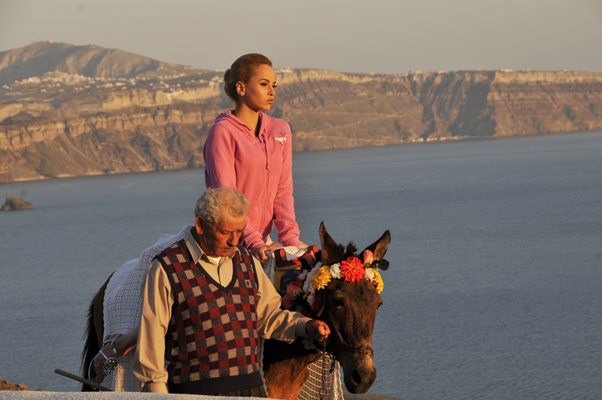 I jumped in a black placier on a beach in Santorini